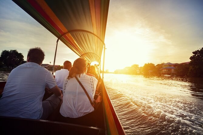 Sunset over the river from the deck of a longtail boat